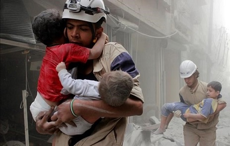 Members of the Civil Defence rescue children after what activists said was an air strike by forces loyal to Syria s President Bashar al-Assad in al-Shaar neighbourhood of Aleppo Syria June 2 2014 REUTERS Sultan Kitaz File Photo TPX IMAGES OF THE DAY